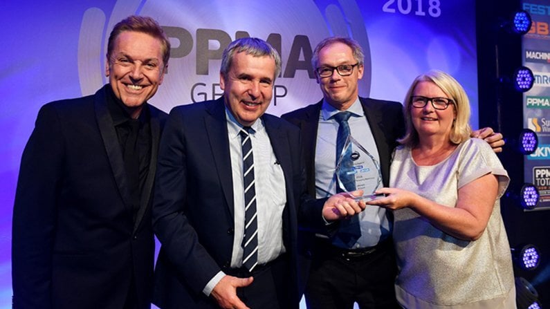 image of-Host-Brian-Conley-with-Brillopaks-Peter-Newman-David-Jahn-and-Gail-Hunt-editor-of-Machinery-Update