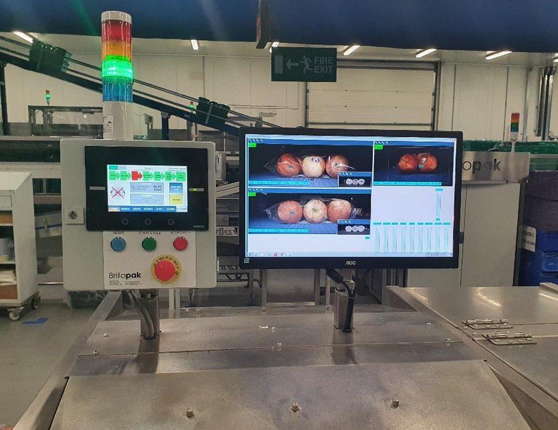 Food production line transporting food from one section to another with a machine vision inspection system to check on accuracy.